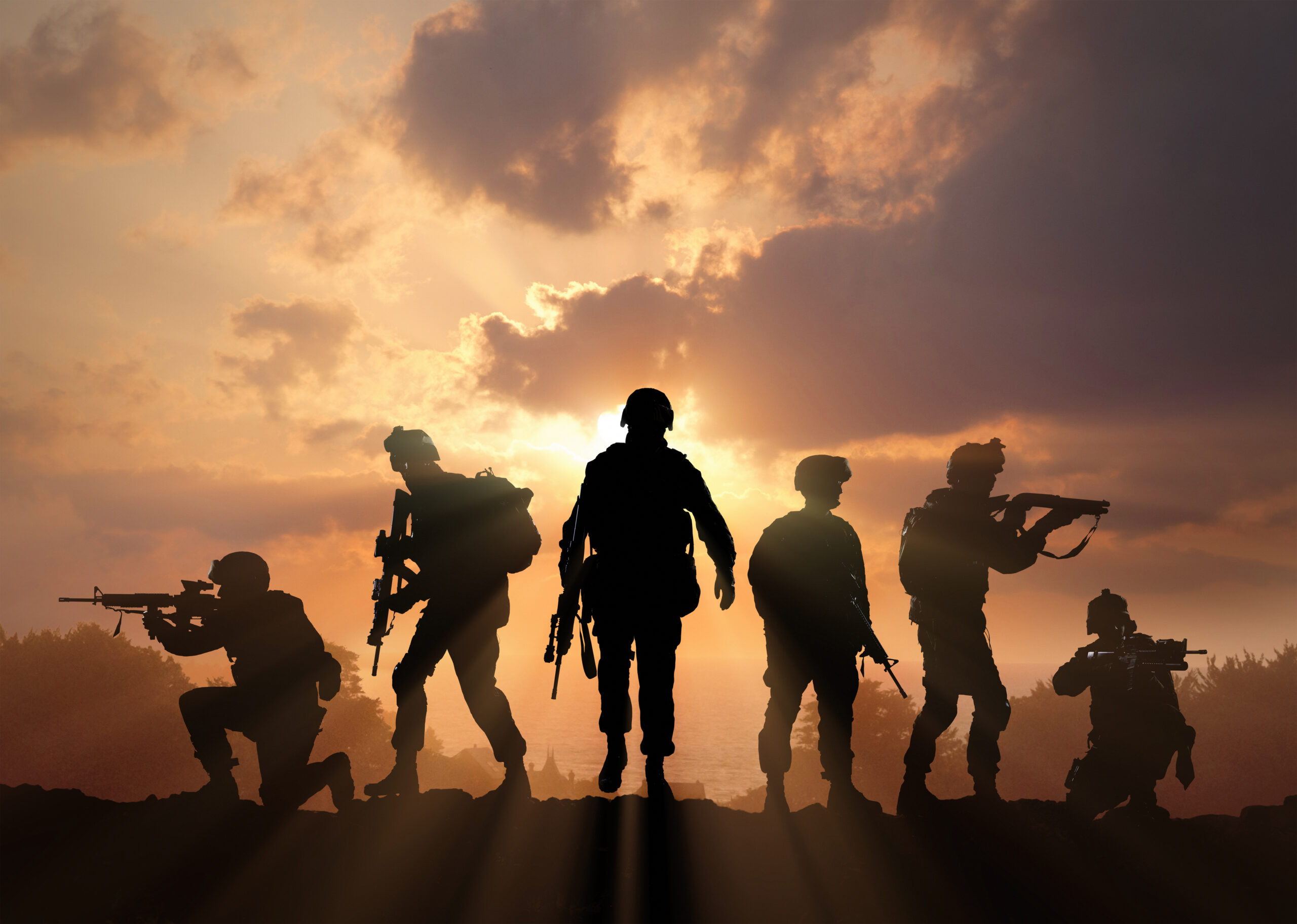 Six Military Silhouettes On Sunset Sky Background